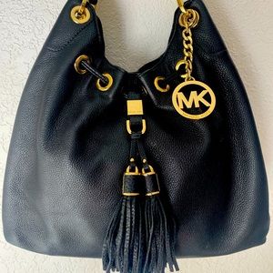 Michael Kors purse, Black with gold accents.